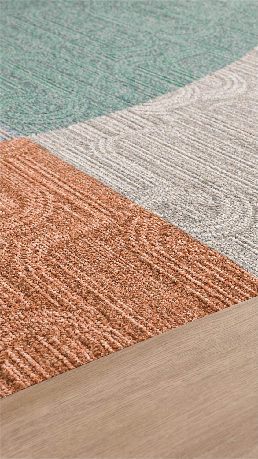 Mix of Tarkett sustainable carpet tiles and modular vinyl