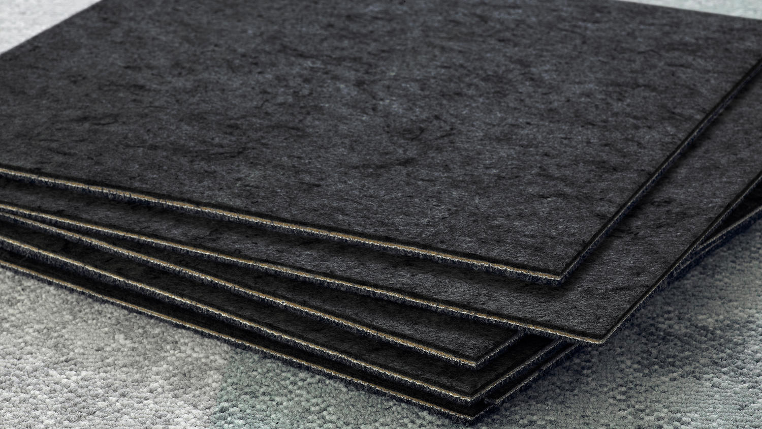 Carpet tiles showing the DESSO SoundMaster Thrive acoustic felt underlay